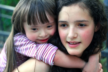 Portrait of beautiful young girls in the park .