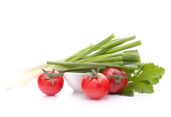 Spring onions and cherry tomato in bowl