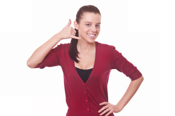 woman in red blouse making gesture call me