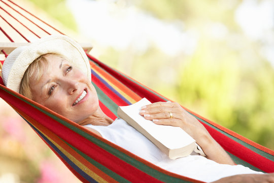 Senior Woman Relaxing In Hammock