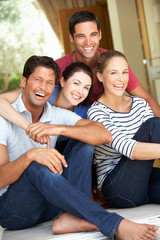 Group Of Friends Sitting Outside House