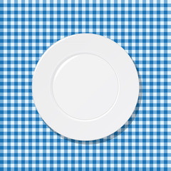 Plate on blue tablecloth