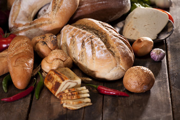 traditional cheese near bread and vegetable