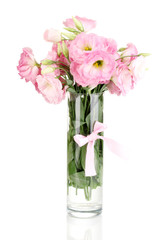 bouquet of eustoma flowers in vase, isolated on white