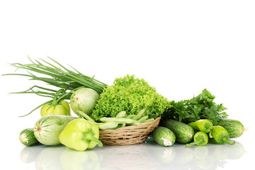 fresh green vegetables in basket isolated on white