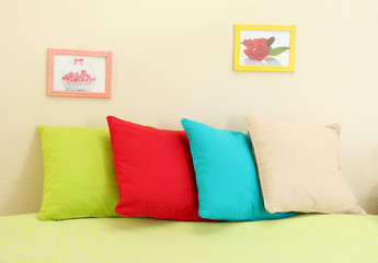 Empty bed with pillows and sheets in bedroom