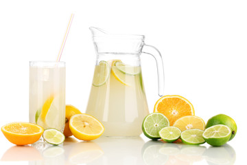 Citrus lemonade in pitcher and glass of citrus around isolated