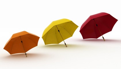 three multicoloured umbrellas on a white