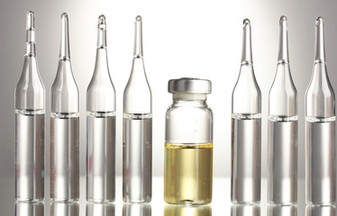 medical ampules on grey background