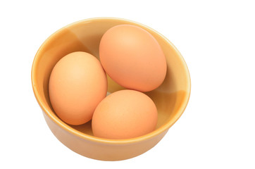 Eggs in a cup isolated on white background