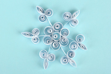 beautiful paper snowflake, on blue background