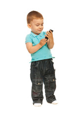 Toddler boy holding a cellphone