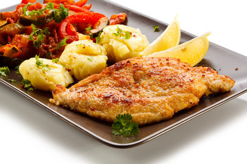 Pork chops, mashed potatoes and vegetable salad