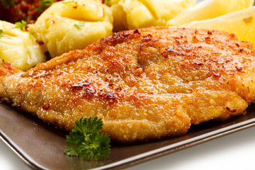 Pork chops, mashed potatoes and vegetable salad