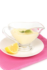 Mayonnaise in bowl on napkin isolated on white