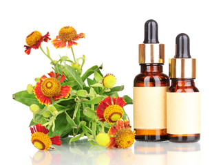 medicine bottles and flowers isolated on white