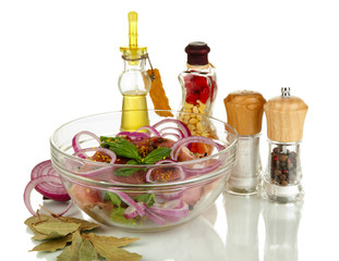 A large piece of pork marinated in bowl with herbs, spices and