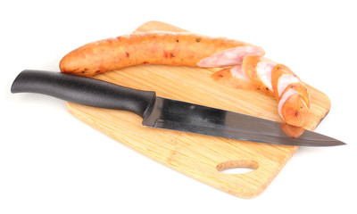 Tasty sausage on chopping board isolated on white