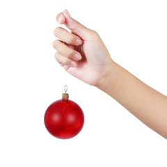 Hand holding a christmas ball against a white background