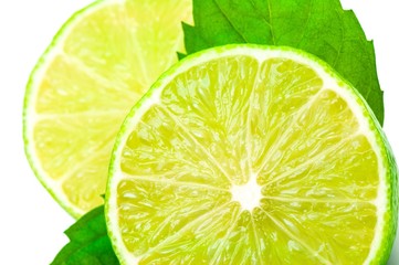 Juicy slices of lemon and leaf of mint