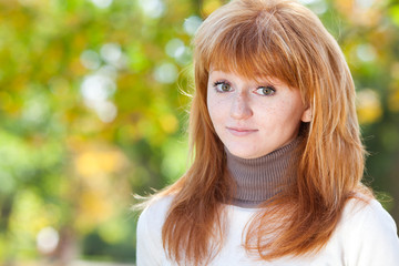 Naklejka premium portrait of a beautiful young redhead teenager woman