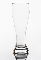 Empty crystal beer glass on a white background