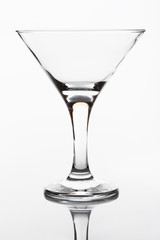 Empty martini glass on a white background