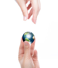 Hands with earth (Elements of this image furnished by NASA)