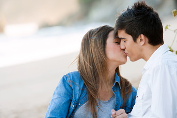 Romantic kiss on beach.