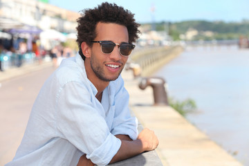 Man in front of the river dock