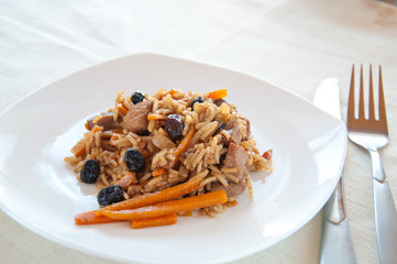 Pilaf with turkey, carrots, spices, and dried fruits