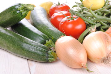 fresh organic vegetables on a wooden table