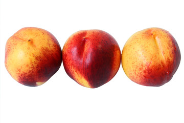 3 ripe peaches isolated on white background