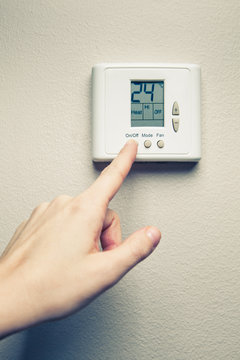 hand with digital climate control