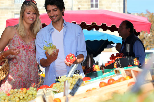 Young Couple At A Market Stall