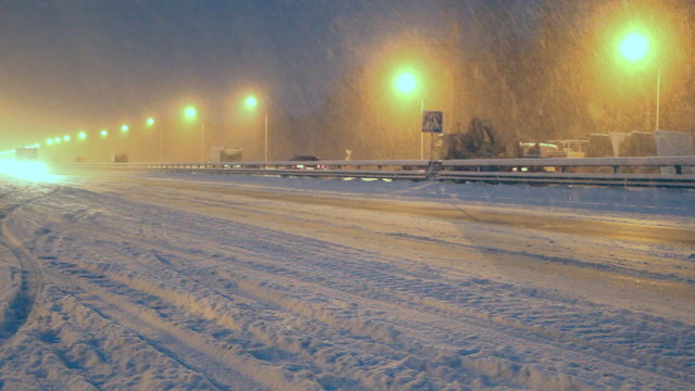 Winter highway. Snow, blizzard, cars