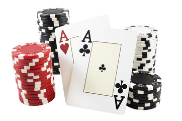 Stack of poker chips and two aces over white isolated background