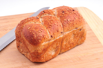 Loaf of dark bread on the board