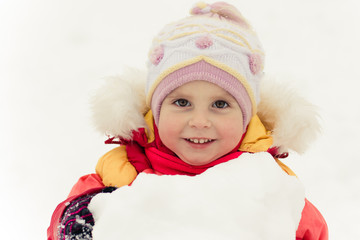 Beautiful baby in a red jacket