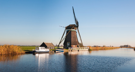 Dutch windmill on the river banks