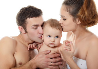 Portrait of a young happy family with the kid