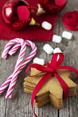 Gingerbread cookies with candy canes and christmas ornaments
