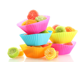 sweet jelly candies in cup cake cases isolated on white.