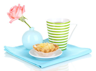 sweet cake with cup of tea isolated on white