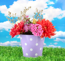 Purple bucket with white polka-dot with flowers