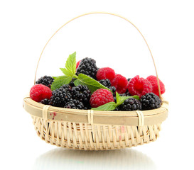 beautiful berries with leaves in basket isolated on white