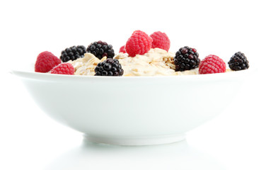 tasty oatmeal with berries, isolated on white