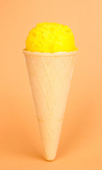 Scoop of the lemon ice cream in the waffle cone
