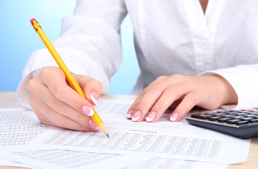 Closeup of businesswoman hands, working in office room