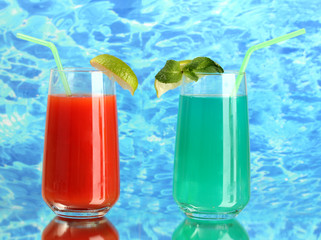Two cocktails on blue background